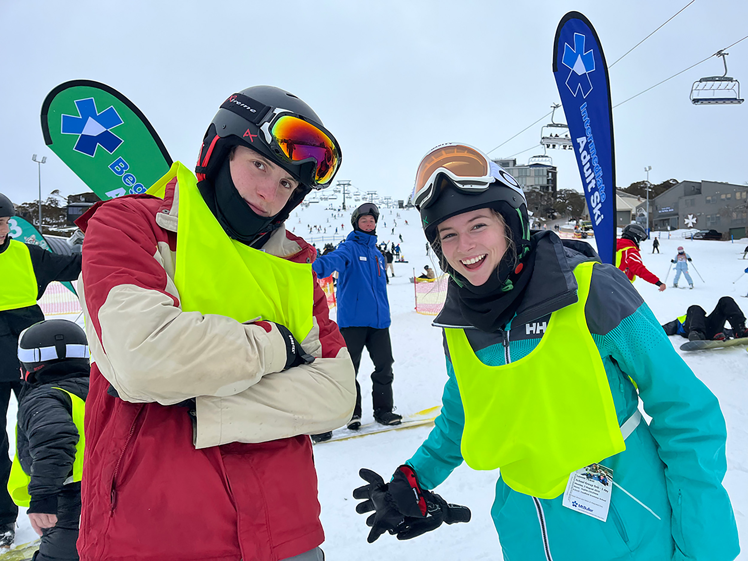 Two students in winter gear standing in the snow during a Senior School Outdoor Education skiing excursion.