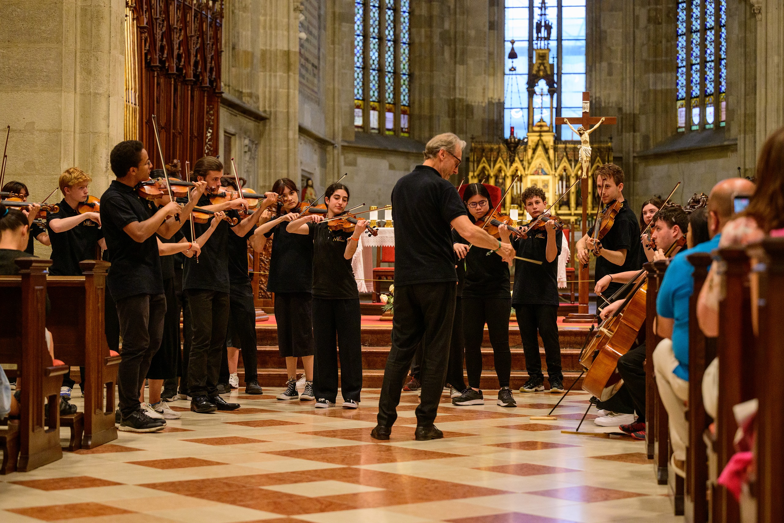 A group of students on a musical tour, performing in St. Martin's Cathedral