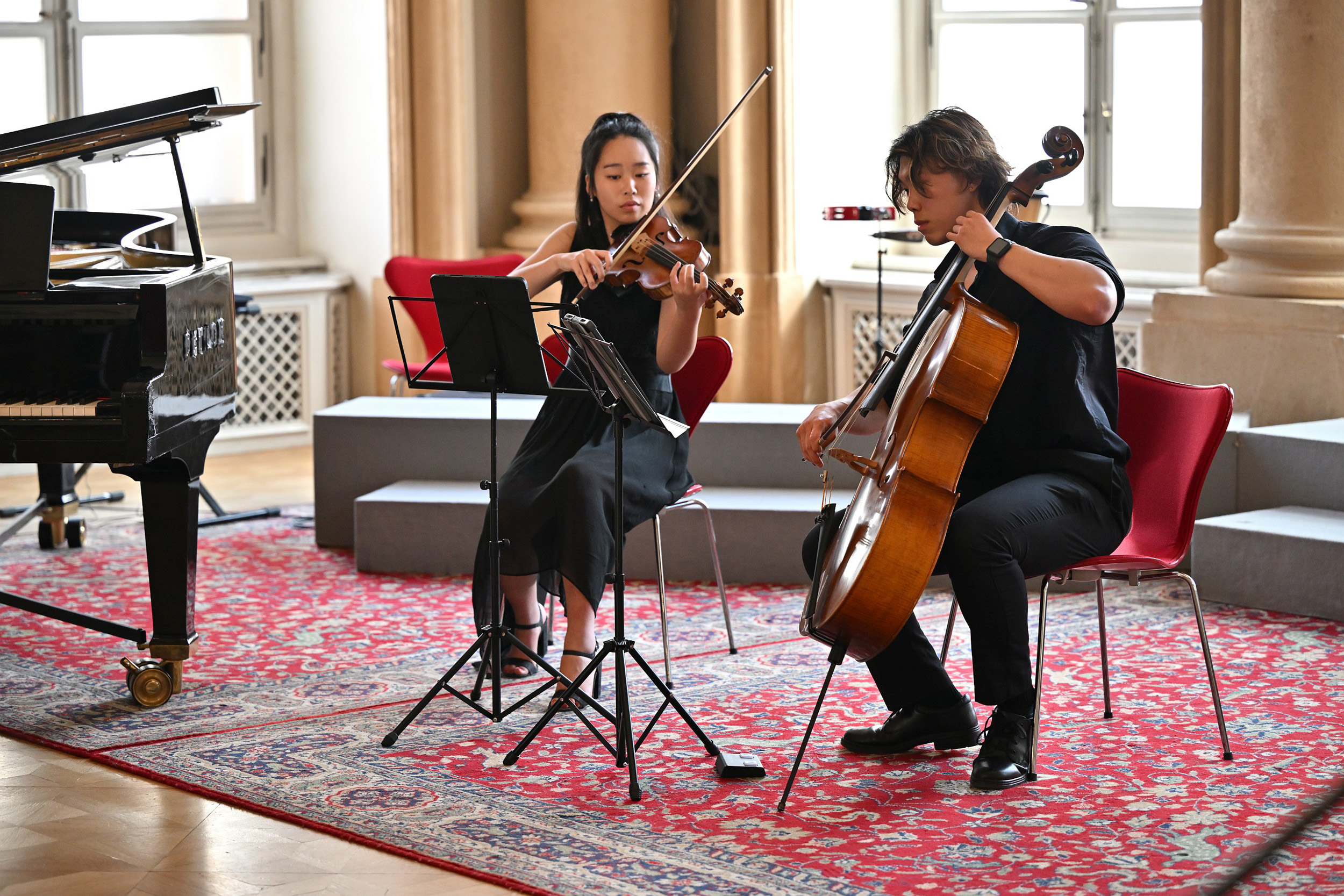Two students playing violin and cello together