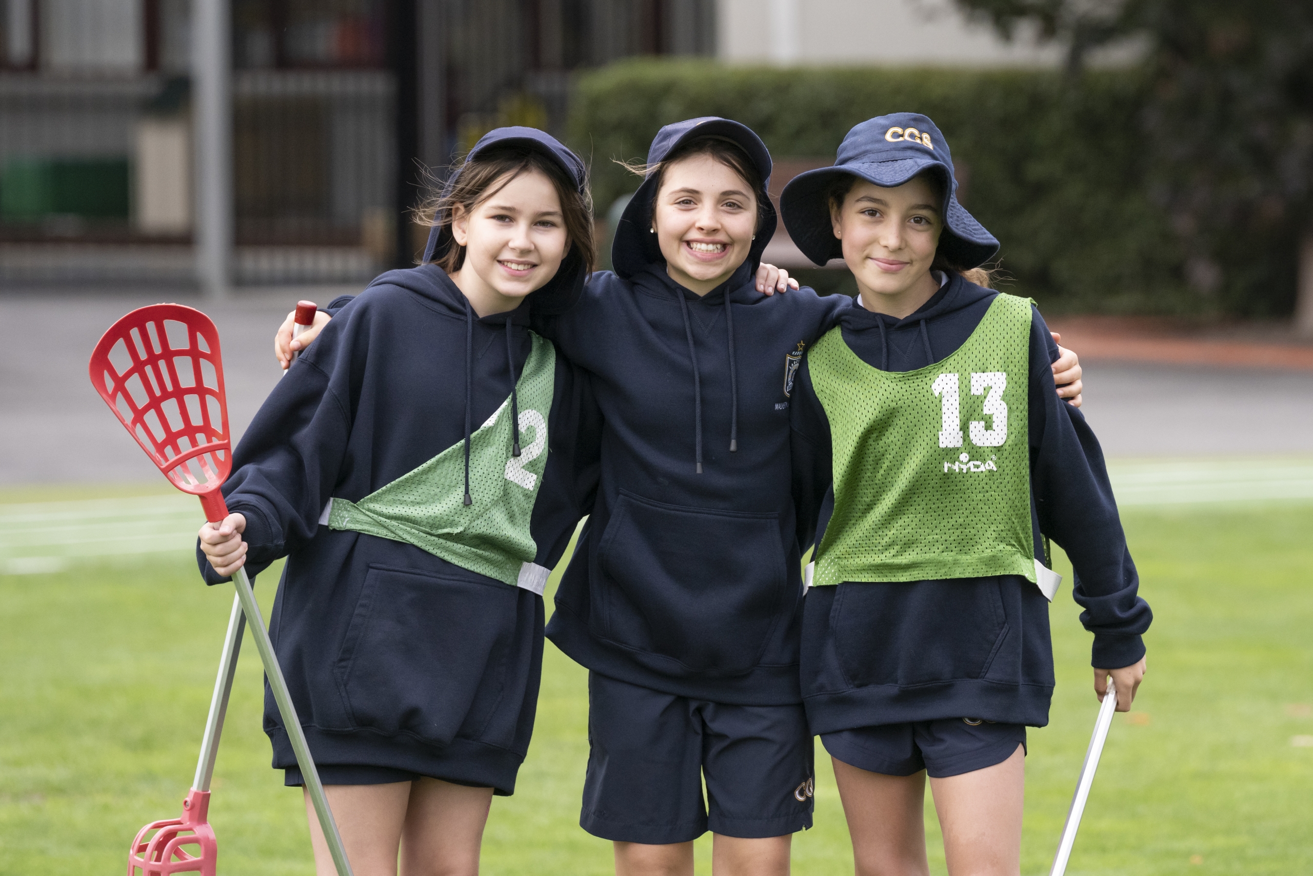 Junior School Students at practice with lacrosse sticks