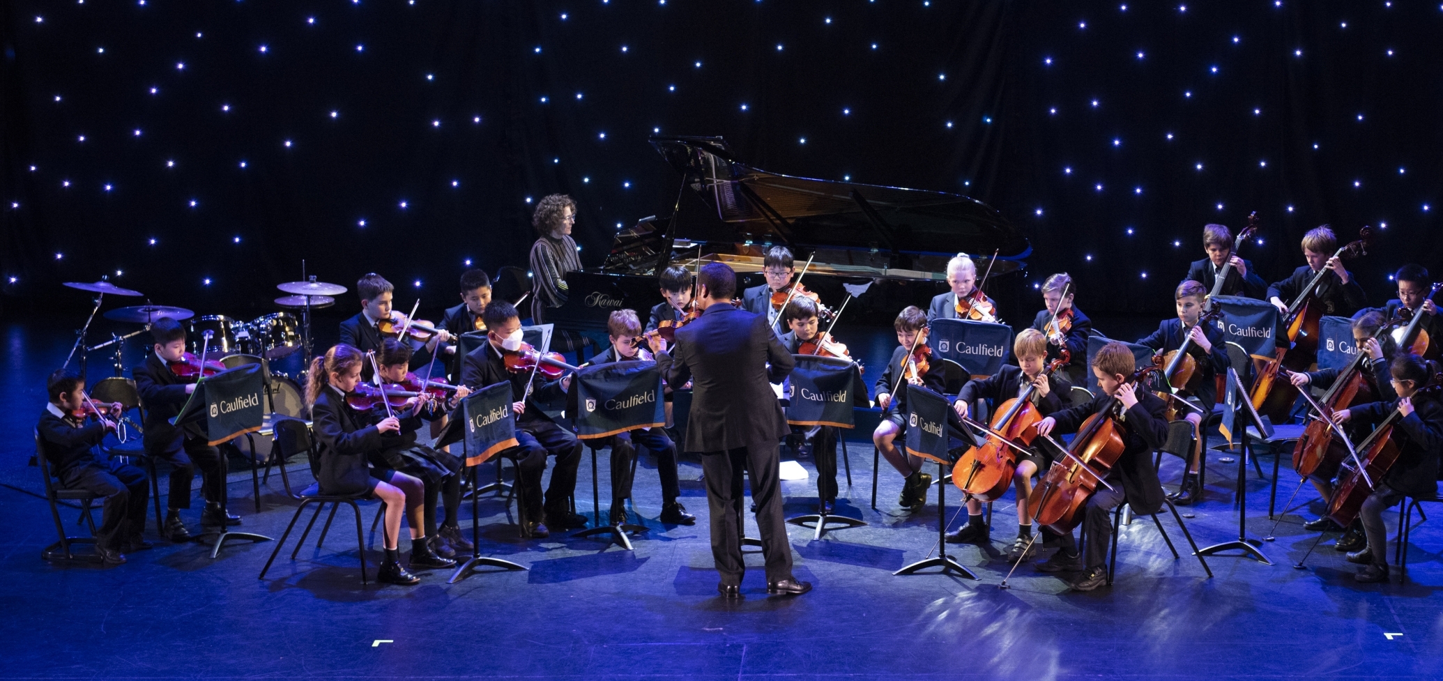 Caulfield Grammar school students playing violin and cello during a concert